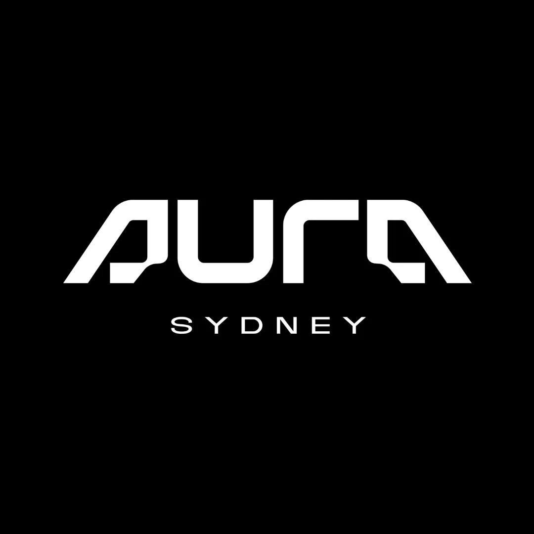Inside Aura Sydney nightclub in Darlinghurst with vibrant crowd, music, and VIP table setup